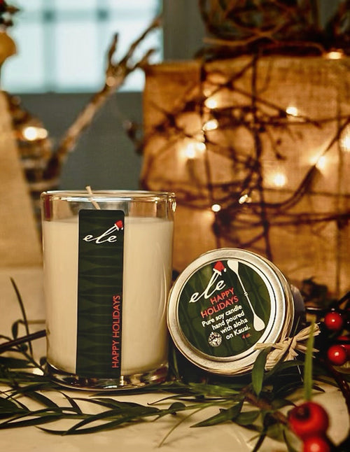 Happy Holidays glass candle and 4 oz tin in festive greenery, portrait crop matching the other holiday scents